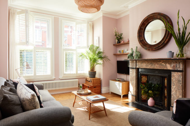Interiors of refurbished south london appartment, living room with pink walls