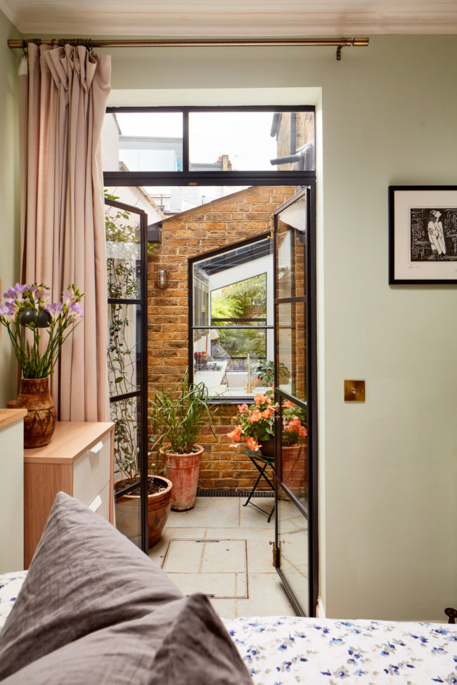 Interiors of refurbished south london appartment, bedroom with green walls