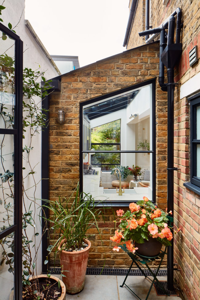 Interiors of refurbished south london appartment, exterior courtyard space