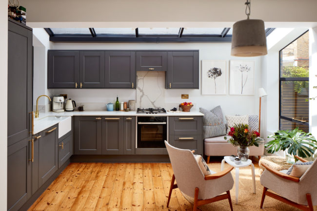 Interiors of refurbished south london appartment, kitchen with grey work units and wooden floor